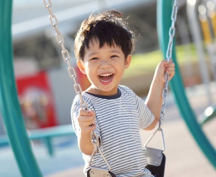 cute-little-asian-boy-enjoying-swing-at-the-modern-playground_t20_NGoQAp